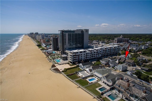 bird's eye view featuring a view of the beach and a water view