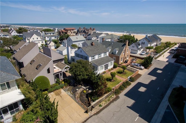 birds eye view of property featuring a water view and a residential view