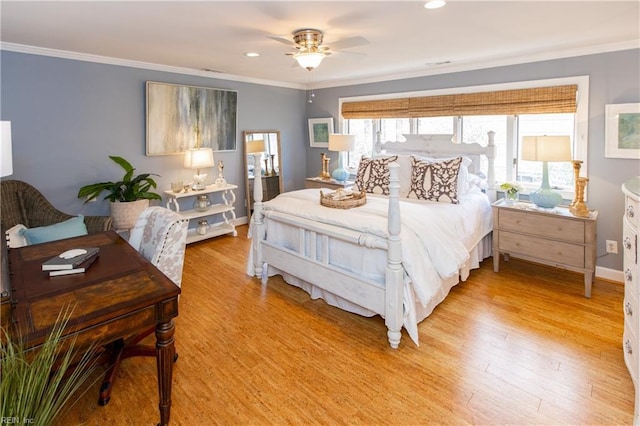 bedroom with crown molding and light wood-type flooring