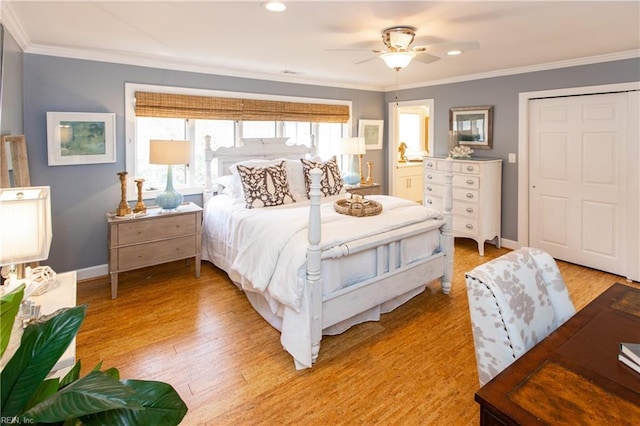 bedroom featuring light wood-type flooring, crown molding, baseboards, and recessed lighting