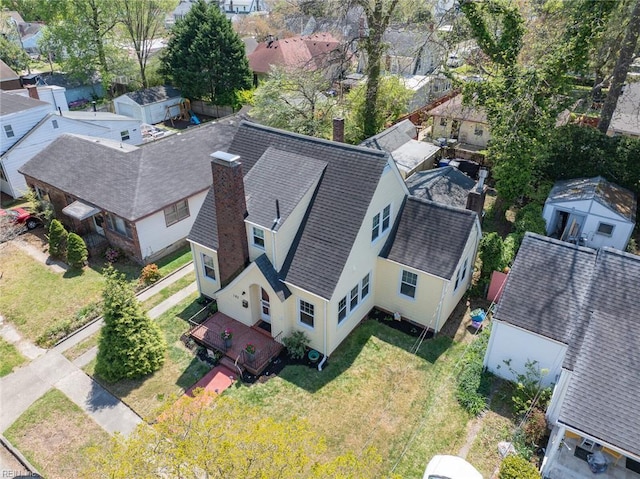 birds eye view of property with a residential view