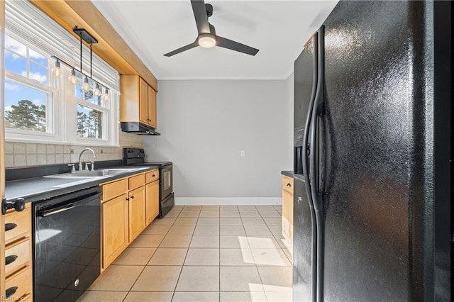 kitchen with a sink, ceiling fan, dark countertops, black appliances, and decorative backsplash