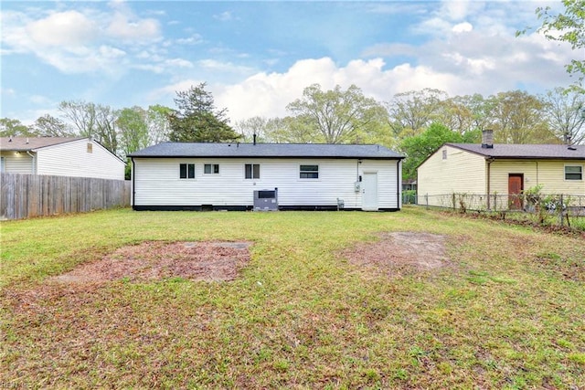 25 Tillerson Dr, Newport News, VA 23602 - back of property with a yard, a fenced backyard, and cooling unit