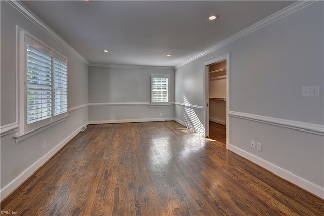 unfurnished room featuring wood finished floors, baseboards, ornamental molding, and recessed lighting