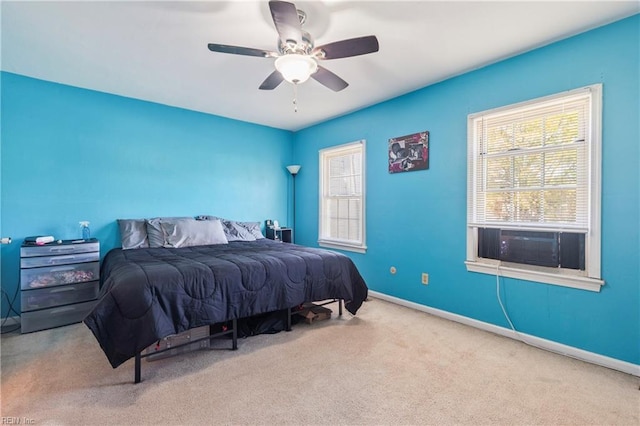 bedroom featuring cooling unit, baseboards, a ceiling fan, and carpet floors