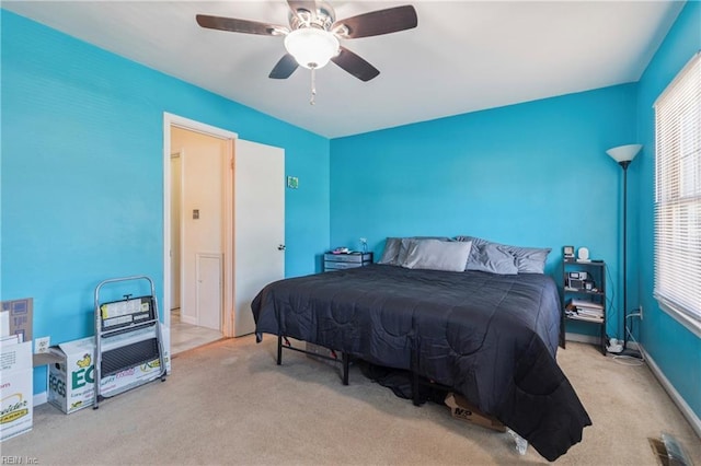 bedroom featuring ceiling fan, carpet flooring, and baseboards