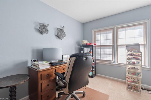 home office with baseboards and carpet floors