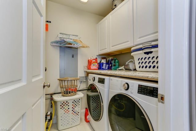 washroom featuring cabinet space, tile patterned flooring, and independent washer and dryer