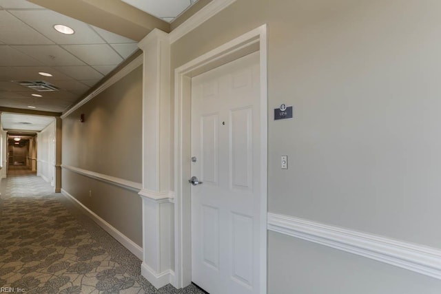 corridor featuring visible vents, baseboards, carpet, recessed lighting, and crown molding