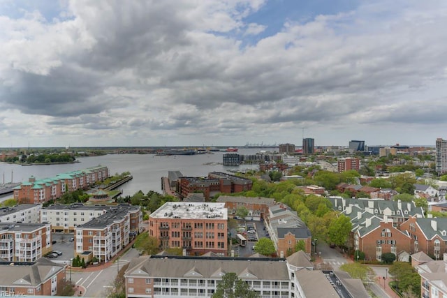 drone / aerial view with a city view and a water view