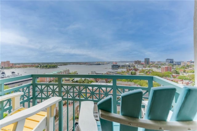 balcony featuring a water view and a view of city