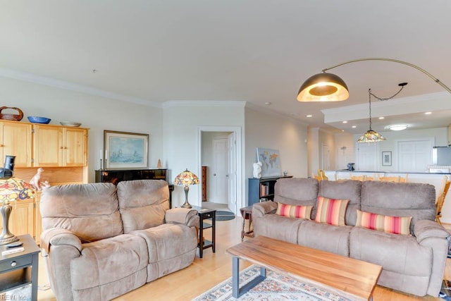 living room featuring recessed lighting, light wood-type flooring, and crown molding