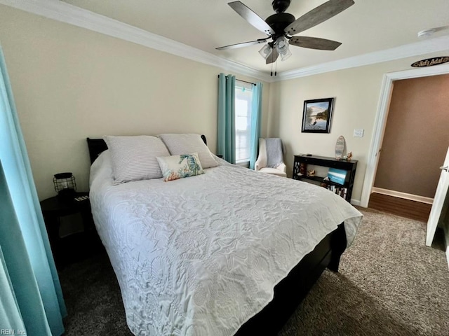 bedroom with ornamental molding, baseboards, a ceiling fan, and carpet flooring