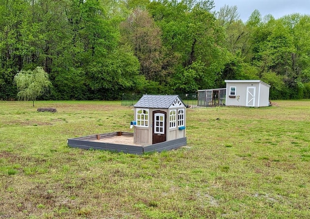 view of shed with a wooded view