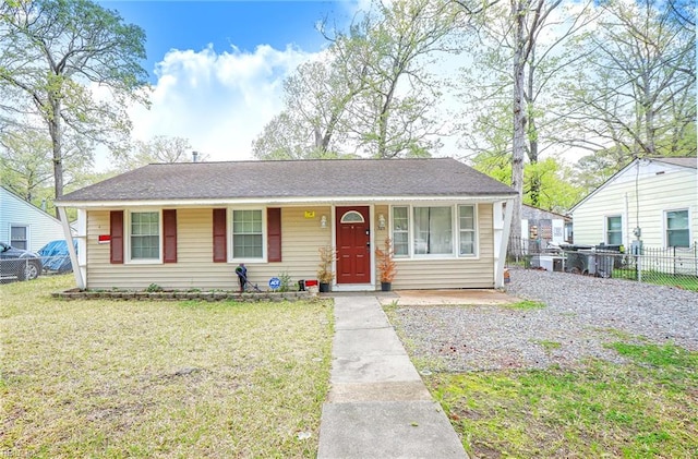 view of front of property with a front yard and fence