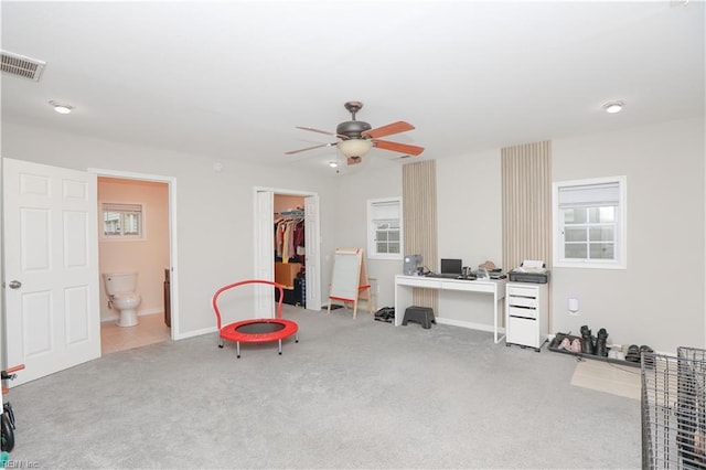 recreation room featuring baseboards, a ceiling fan, visible vents, and carpet floors