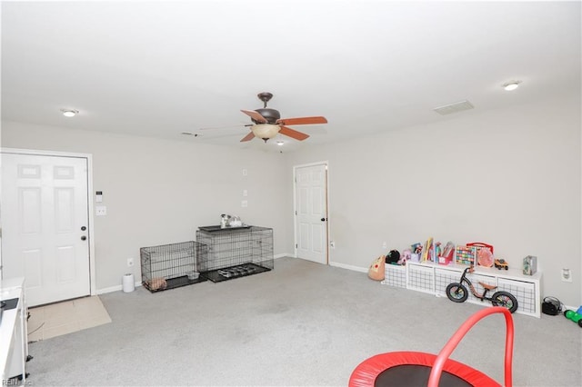 rec room featuring visible vents, baseboards, a ceiling fan, and carpet floors