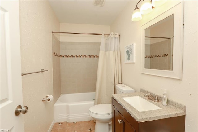 bathroom with visible vents, toilet, shower / bath combo with shower curtain, vanity, and tile patterned floors