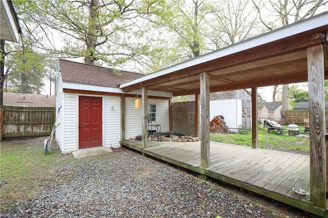 wooden terrace featuring fence