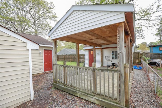exterior space with an outbuilding and fence