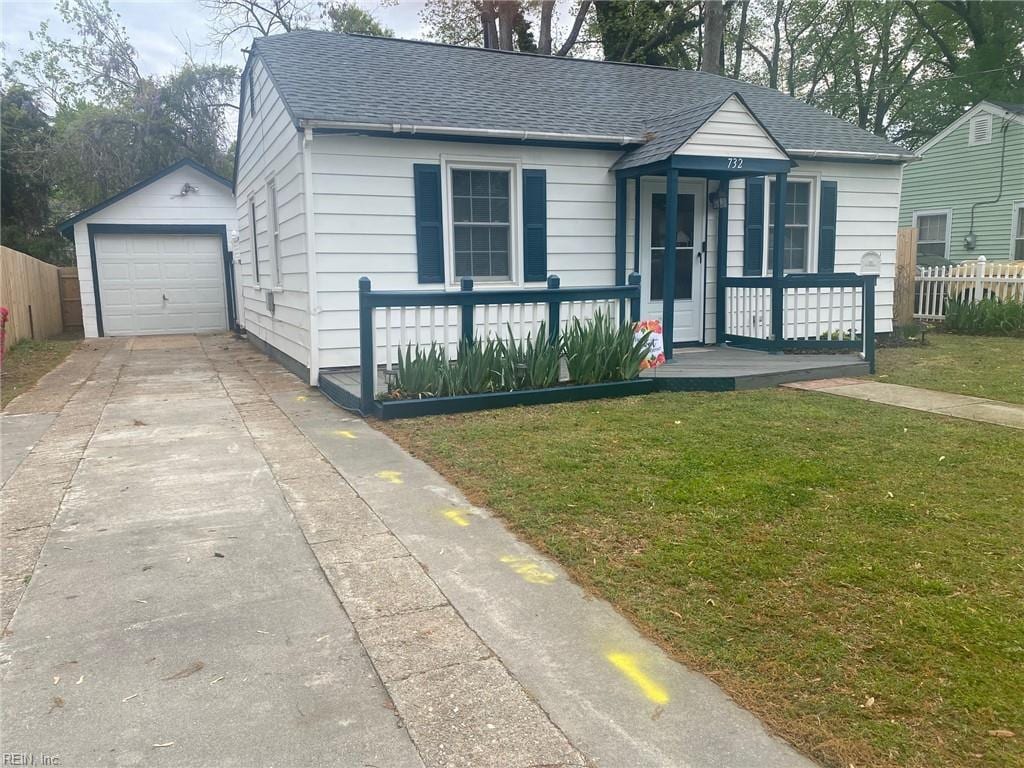 732 Westwood Ave, Hampton, VA 23661 - view of front facade with a shingled roof, concrete driveway, fence, and covered porch