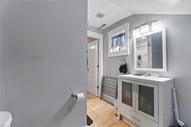 3410 E Princess Anne Rd, Norfolk, VA 23502 - bathroom featuring vanity, vaulted ceiling, tile patterned flooring, and visible vents