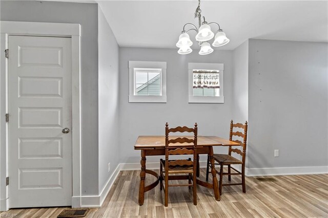 3410 E Princess Anne Rd, Norfolk, VA 23502 - dining area featuring a chandelier, light wood-style floors, baseboards, and visible vents