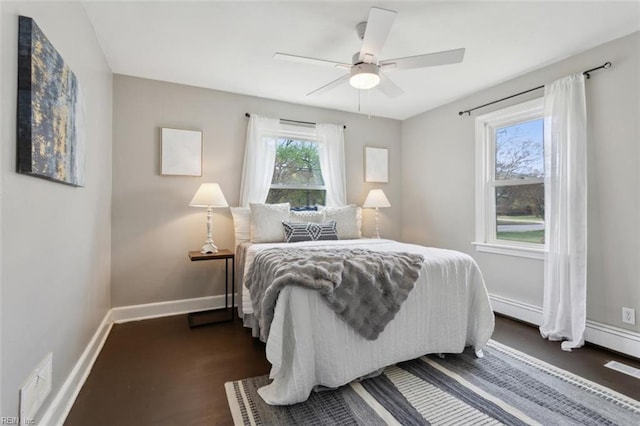 bedroom featuring ceiling fan and baseboards