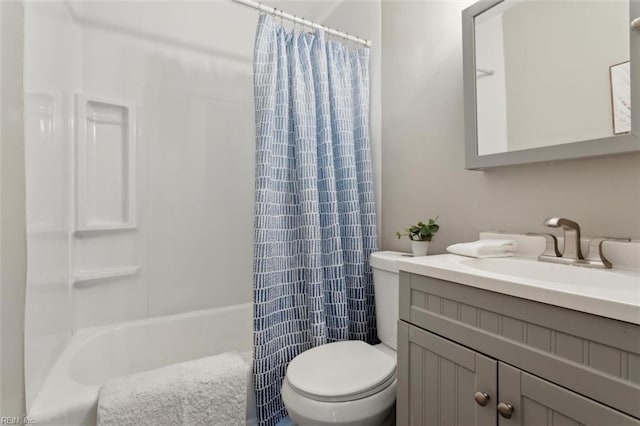 bathroom with toilet, shower / bathtub combination with curtain, and vanity