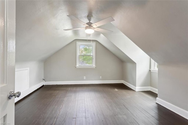 bonus room featuring baseboards, a ceiling fan, lofted ceiling, and hardwood / wood-style flooring