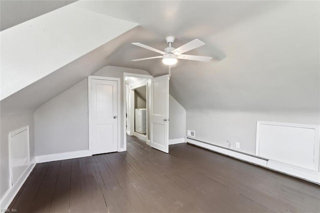 bonus room featuring ceiling fan, baseboard heating, wood-type flooring, lofted ceiling, and baseboards