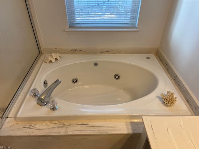 full bathroom featuring a whirlpool tub