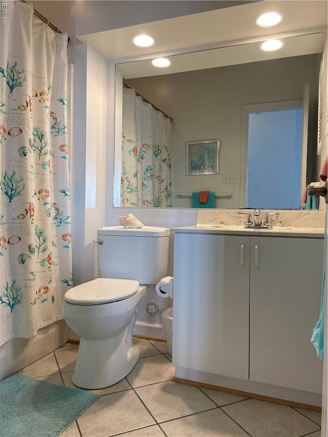 bathroom featuring tile patterned floors, toilet, recessed lighting, and vanity