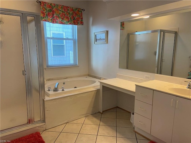 bathroom featuring a tub with jets, a shower stall, tile patterned flooring, and vanity