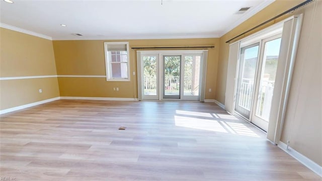 301 Brooke Ave Unit 105, Norfolk, VA 23510 - spare room with crown molding, visible vents, baseboards, and light wood-style flooring