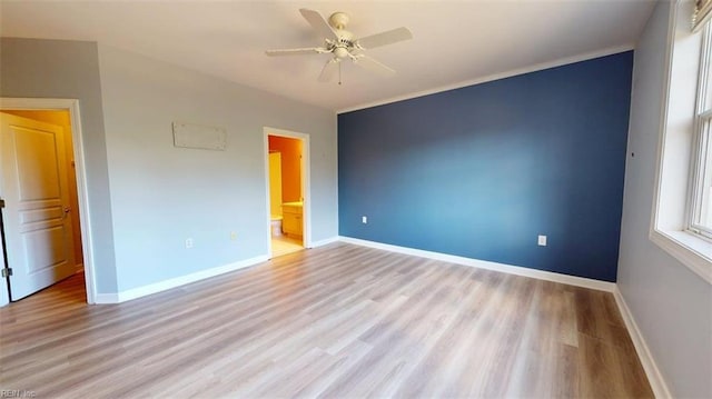 301 Brooke Ave Unit 105, Norfolk, VA 23510 - unfurnished bedroom featuring light wood-type flooring, baseboards, a ceiling fan, and ensuite bath