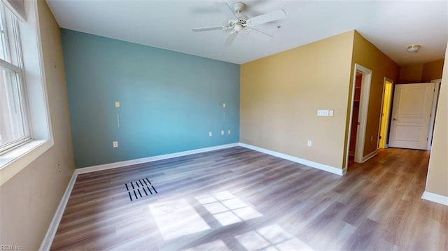 301 Brooke Ave Unit 105, Norfolk, VA 23510 - empty room with baseboards, wood finished floors, and ceiling fan