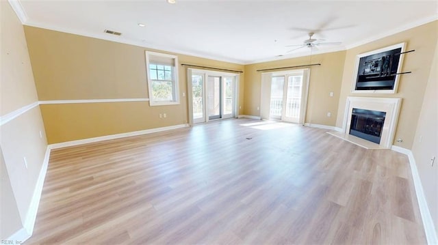 301 Brooke Ave Unit 105, Norfolk, VA 23510 - unfurnished living room with baseboards, ornamental molding, a ceiling fan, a fireplace with flush hearth, and light wood-style flooring