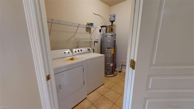 301 Brooke Ave Unit 105, Norfolk, VA 23510 - washroom with laundry area, washing machine and clothes dryer, electric water heater, and light tile patterned floors