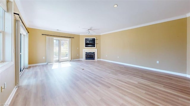 301 Brooke Ave Unit 105, Norfolk, VA 23510 - unfurnished living room featuring crown molding, a ceiling fan, light wood finished floors, and a fireplace
