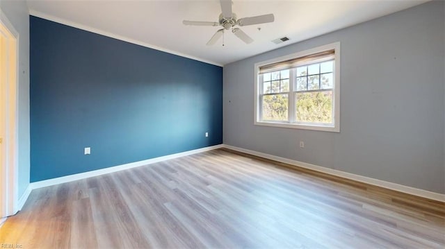 301 Brooke Ave Unit 105, Norfolk, VA 23510 - empty room with visible vents, baseboards, a ceiling fan, crown molding, and wood finished floors