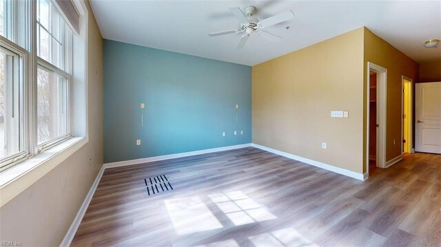 301 Brooke Ave Unit 105, Norfolk, VA 23510 - empty room with wood finished floors, ceiling fan, and baseboards