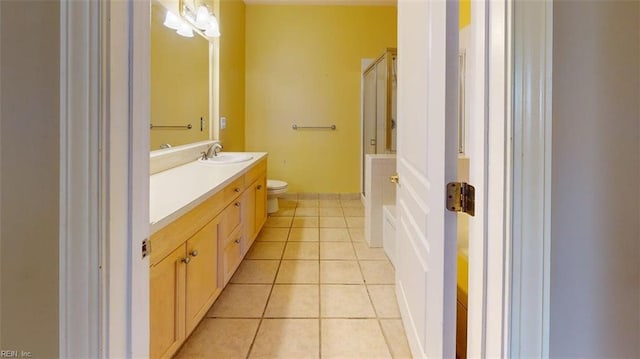 301 Brooke Ave Unit 105, Norfolk, VA 23510 - bathroom with toilet, tile patterned flooring, a shower with door, and vanity