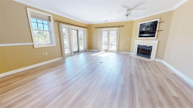 301 Brooke Ave Unit 105, Norfolk, VA 23510 - unfurnished living room with a wealth of natural light, a ceiling fan, and crown molding