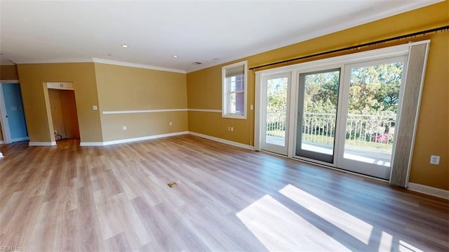 301 Brooke Ave Unit 105, Norfolk, VA 23510 - unfurnished room with light wood-style floors, baseboards, and ornamental molding