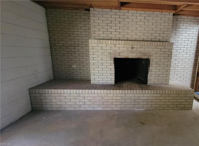 room details with a fireplace and concrete flooring