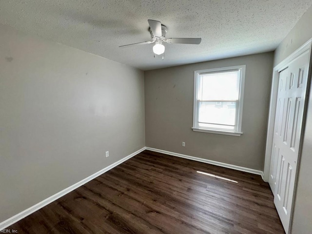 3216 Winterberry Ct, Virginia Beach, VA 23453 - unfurnished bedroom with a closet, dark wood-style flooring, baseboards, and a textured ceiling