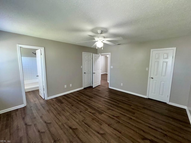 3216 Winterberry Ct, Virginia Beach, VA 23453 - unfurnished bedroom featuring baseboards, dark wood finished floors, ensuite bathroom, a textured ceiling, and ceiling fan