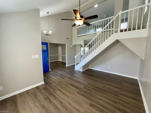 3216 Winterberry Ct, Virginia Beach, VA 23453 - unfurnished living room featuring ceiling fan with notable chandelier, high vaulted ceiling, wood finished floors, stairs, and baseboards