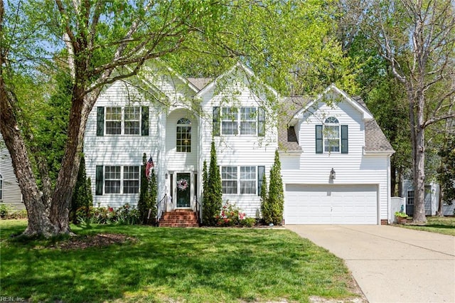 106 Elm Tree Ct, Suffolk, VA 23435 - view of front facade featuring a front yard, a garage, and driveway